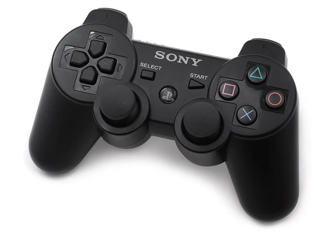 Black Sony DualShock 3 controller on a white background