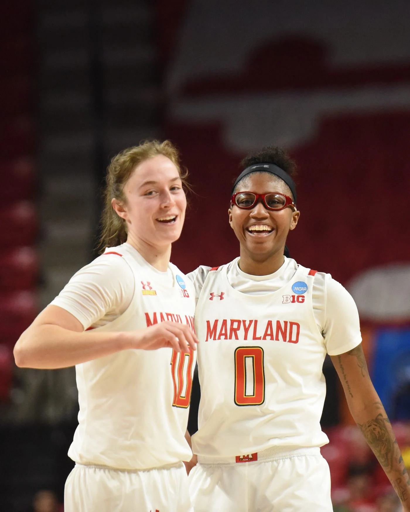 Two Maryland women's basketball players celebrating during an NCAA tournament game